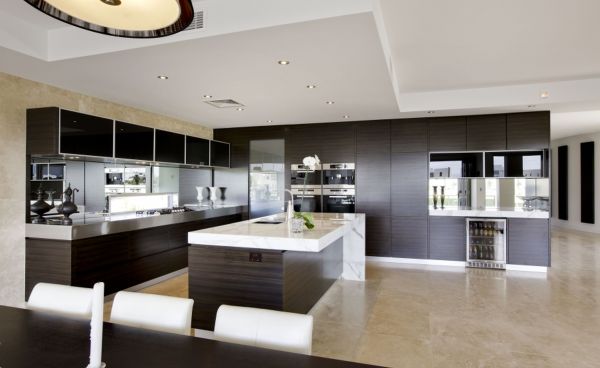 Furniture,Picturesque Open Plan Beautiful Contemporary Kitchen Design Ideas With Charming Large Black Wood Kitchen Cabinet And Nice Glass Mirror Backsplash Also Cool Kitchen Island On Combined Gorgeous White Granite Countertop Plus Awesome Cream Granite Floor,Beautiful Contemporary Kitchens