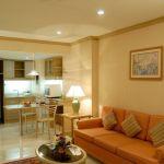 Apartments,Delightful Cream Ceiling Apartment Ideas With Nice Orange Three Seater Sofa And Beautiful White Square Accent Table On Combined Gorgeous Table Lamp Also Unusual Open Plan Kitchen Plus Modern White Ceramic Tile Floor,Comfort Studio For Contemporary Apartment Ideas