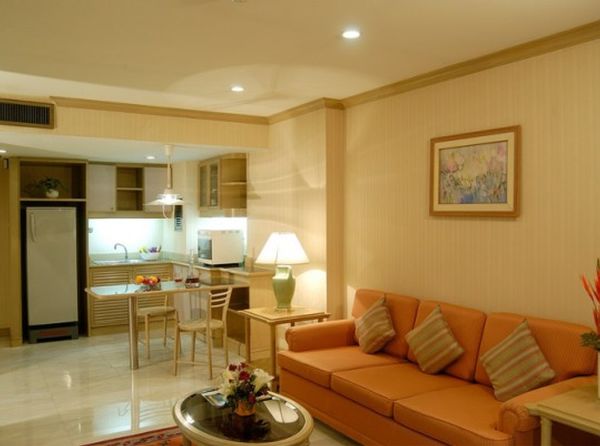 Apartments,Delightful Cream Ceiling Apartment Ideas With Nice Orange Three Seater Sofa And Beautiful White Square Accent Table On Combined Gorgeous Table Lamp Also Unusual Open Plan Kitchen Plus Modern White Ceramic Tile Floor,Comfort Studio For Contemporary Apartment Ideas