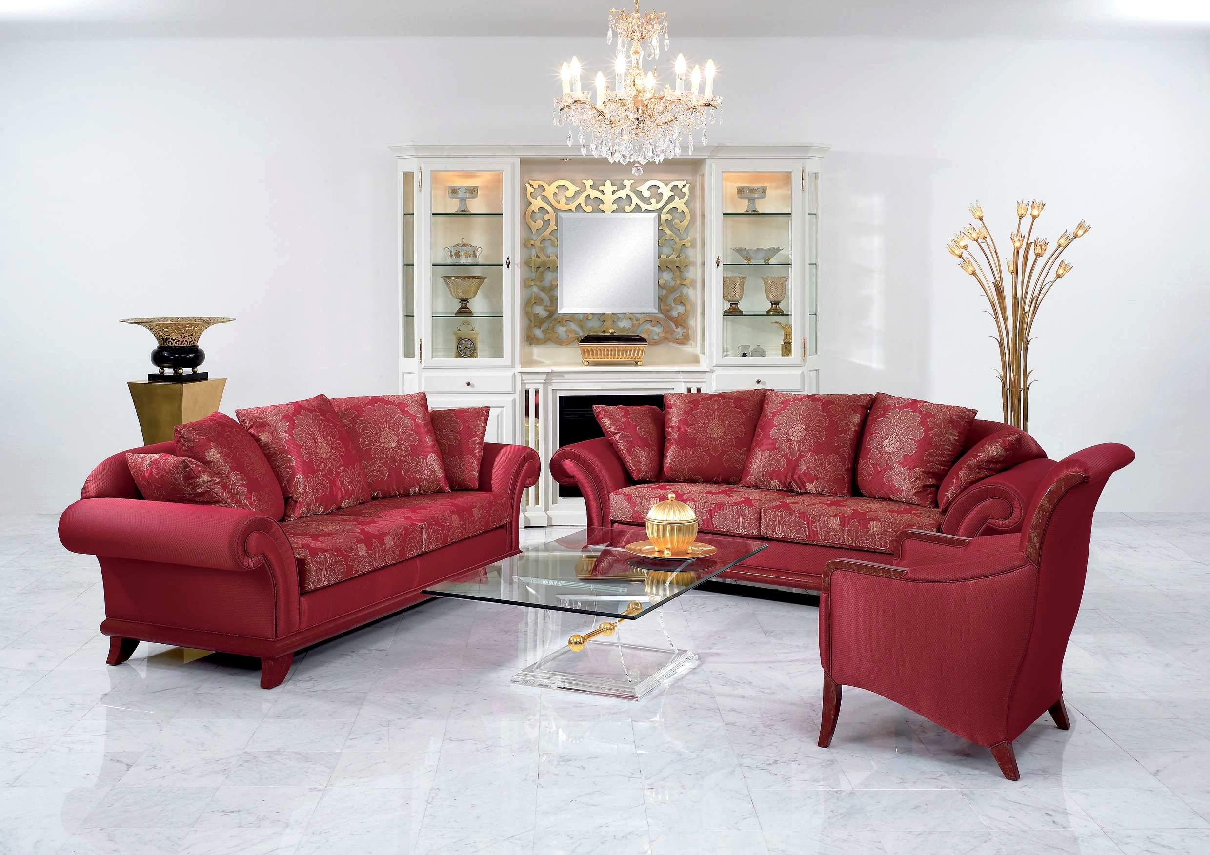 Interior,The Best High Quality Interior Designer Living Room Design Inspiration With Amazing Red Pattern Sofas And Modern Glass Rectangular Table Plus Luxurious Crystal Chandelier Also Gorgeous White Freestanding Cabinet,The Best High Quality And Cheap Interior Designer Living Rooms