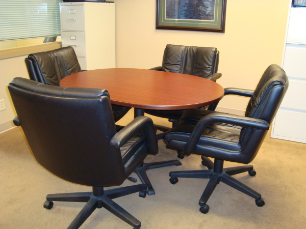 Furniture,Unusual Top Office Design Ideas With Charming Brown Oval Wood Desk And Comfortable Black Leather Wheels Office Chairs Also Cool White Storage Cabinet ,Pleasant And Comfortable Top Office Designs