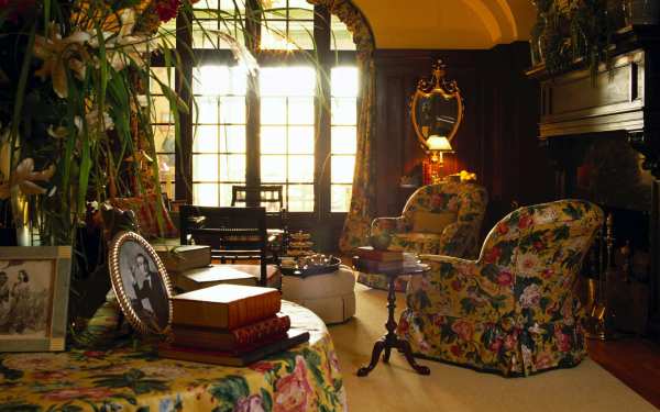 Furniture,Nice Small Space Sitting Room Design Inspiration With Stylish Yellow Sofas On Combined Beautiful Floral Ornament And Wonderful Brown Wood Round Accent Table Also Cool Dom Glass Windows On Combined Soft Yellow Floral Ornament Curtains,Some Fancy Sitting Rooms