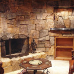 Interior,Stunning Indoor Stone Fireplace Design With Amazing Stone Wall And Beautiful Bright Brown Wooden Rack Plus Vintage Brown Hexagons Table Also Comfortable Brown Leather Chairs,Amazing Indoor Stone Fireplace Designs To A Living Room