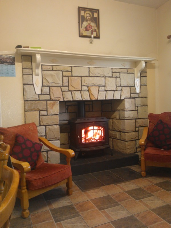 Interior,Winsome Cream Wall Paint Stone Fire Places Design Ideas With Cool Bit Stone Edge Fireplace And Beautiful White Wood Wall Mount Shelf Also Comfortable Brown Wood Armchairs On Combined Soft Red Thick Padded Seat,The Beauty Of Stone Fire Places Your Home Inspiration