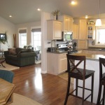 Furniture,Picturesque Brown Wood Open Kitchen Floor Plan Design Ideas With Beautiful White Wood Floating Kitchen Cabinet And Comfortable Dark Green Single Seater Sofa Also Cool Glass Table On Combined Soft White Fur Rug Plus Charming Double Wood Bar Stool In Black Color ,Awesome Open Kitchen Floor Plans Design