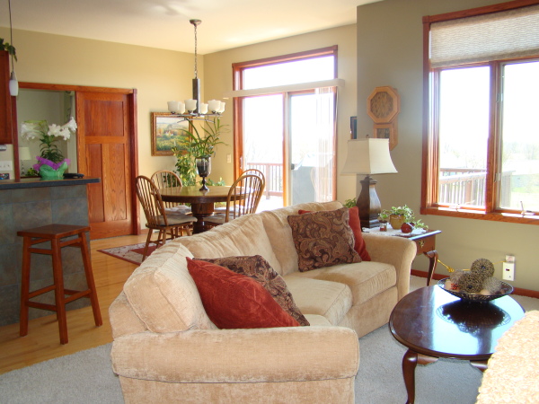 Furniture,Wonderful Cream Wall Paint Sofa For Small Living Room Design Inspiration With Comfortable Light Brown Fabric Sectional Sofa On Combined Soft Gray Rug And Charming Brown Oval Wood Table Also Cool Open Plan Dining Room ,The Most Convenient Sofas For Small Living Rooms