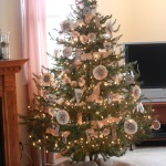 Furniture,Fabulous Cream Wall Paint Design Christmas Tree Ornament With Creative DIY Christmas Tree On Combined Beautiful White Flowery Paper Ornaments And Cool Brown Wood Entertainment Center Plus Nice Tv Stand Also Wonderful Pink Curtains,Spectacular Designer Christmas Tree Ornaments