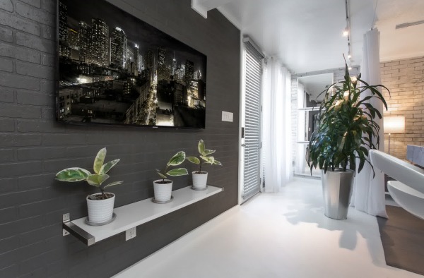 Furniture,Breathtaking Tv Wall Panel Design Ideas With Stylish Black Exposed Brick Wall And Wonderful White Wood Floating On Combined Beautiful Three Plant Under Mounted Tv Also Gorgeous Great Potted Plant,Modern Tv Wall Panel Designs