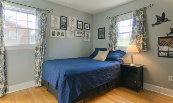 Bedroom,Cool Awesome Very Small Bedroom Design Ideas With Stylish Wheels Bed On Combined Blue Bed Cover And Beautiful Beige Curtains Plus Floral Ornament Also Cool Black Wood Nightstand Table For Rustic Concept,Very Small Bedroom Design And Small Space