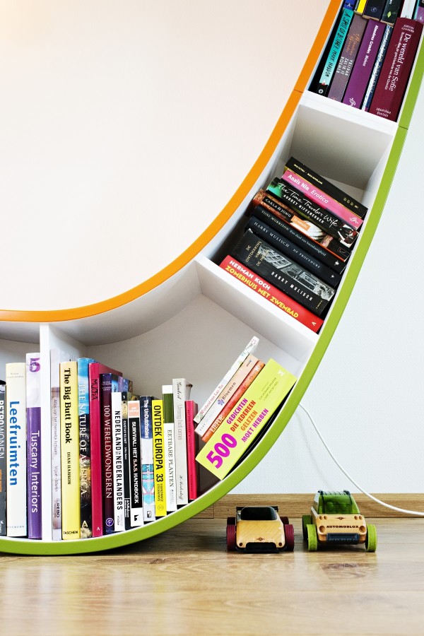 Furniture,Unique And Creative Book Shelf Design Inspiration With Charming Bookworm Chair In Stylish Green White Orange Color Also Gorgeous White Wall Paint Plus Trendy Bright Brown Wood Floor,Contemporary Furniture Book Shelf Designs 2015