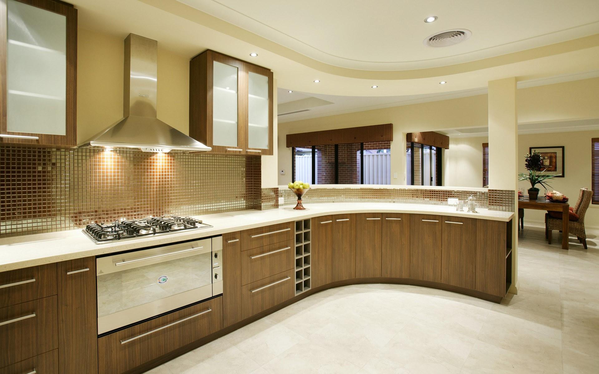 Furniture,Breathtaking Interior Design Picture With Adorable Brown Wood Curved Shape Kitchen Cabinet On Combined Nice White Marble Countertop And Beautiful Floating Clear Frosted Glass Door Kitchen Cabinet Also Gorgeous Stainless Cooker Hood Plus Trendy Cream Wall Paint,Pretentious Interior Design Pictures 2015