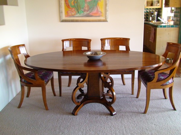 Dining Room,Admirable White Wall Paint Designer Dining Table With Amazing Brown Glossy Oval Dining Table And Comfortable Brown Glossy Dining Chairs Also Soft Gray Carpet,Will Make The Eyes Entranced Designer Dining Tables Latest