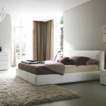 Bedroom,Modern Neutral Bedroom Ideas With Charming White Leather Bed Frame And Beautiful White Wood Nightstand Table On Combined Beautiful Small Cream Table Lamp Plus Gorgeous White Wood Dresser Also Elegant Crystal Chandelier Using Soft Cream Fur Rug,Comfortable Neutral Bedroom Ideas To You
