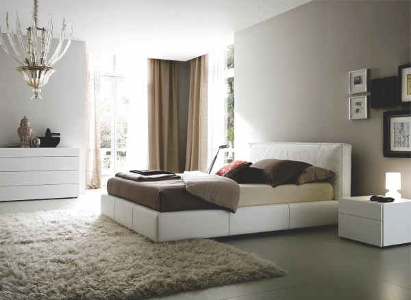 Bedroom,Modern Neutral Bedroom Ideas With Charming White Leather Bed Frame And Beautiful White Wood Nightstand Table On Combined Beautiful Small Cream Table Lamp Plus Gorgeous White Wood Dresser Also Elegant Crystal Chandelier Using Soft Cream Fur Rug,Comfortable Neutral Bedroom Ideas To You