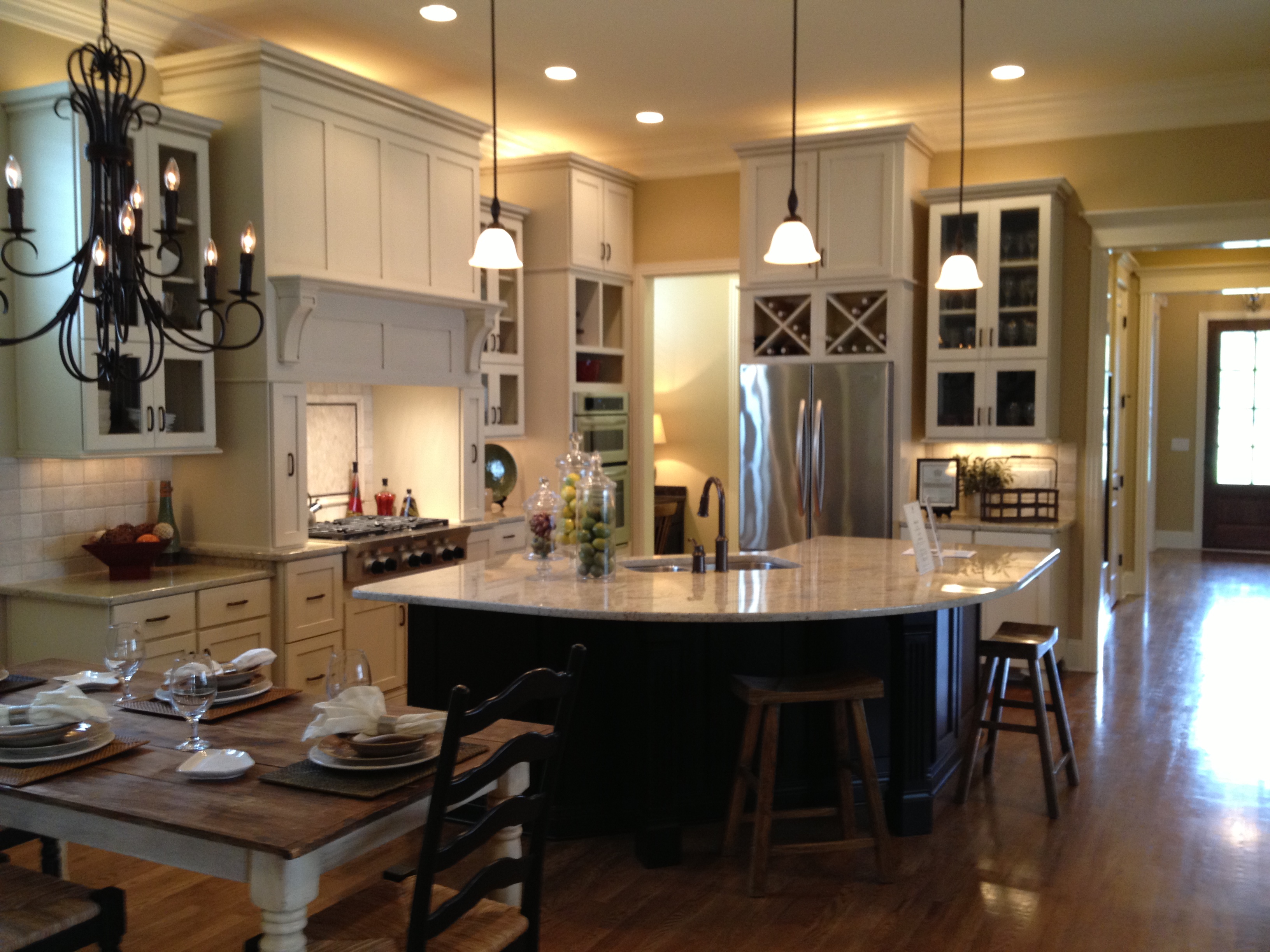 Furniture,Awesome Brown Wood Open Kitchen Floor Plan Design Ideas With Beautiful White Standing Kitchen Cabinet And Wonderful Curved Kitchen Islnad On Combined White Black Color Also Gorgeous Three Hanging Lamp,Awesome Open Kitchen Floor Plans Design
