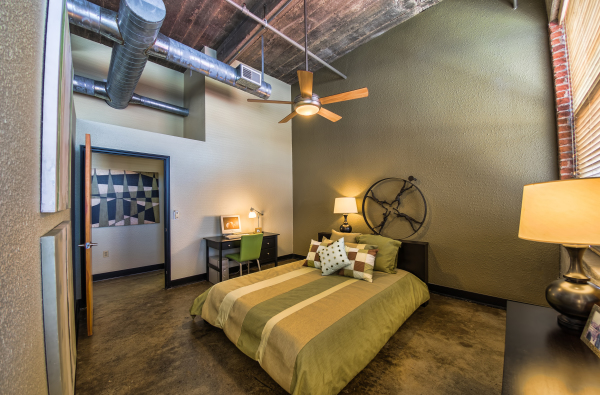 Bedroom,Cool Amazing Large Space Bedroom Design For Guy With Charming Low Profile Bed On Combined Soft Green Light Brown Cream Bedding And Comfortable Study Space Plus Beautiful Desk Lamp Also Cool Fan Ceiling,Cool Bedroom Designs For Guys