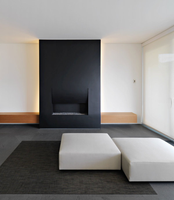 Interior,Dazzling Large Space Interior Design Inspiration With Beautiful Double Ottoman In Nice White Color And Soft Black Natural Fiber Rug Plus Cool Black Recessed Electic Fireplace Also Nice White Mixed Black Wall Paint,Minimalist Interior Designers