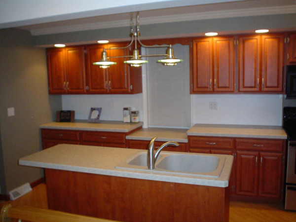 Furniture,Amazing Small Space Cabinet Door Design With Amazing Brown Wood Floating Kitchen Cabinet And Nice Brown Wood Kitchen Cabinet On Combined Beautiful White Ceramic Countertop Also Cool White Brown Kitchen Island Plus Gorgeous Three Hanging Pendant Lamp,Unique Cabinet Doors For Kitchen