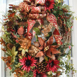 Interior,Trendy Christmas Wreath Decorating Ideas With Nice Christmas Tuscan Winter Wreath Front Door And Beautiful Brown Burgundy Poinsettia Pine Cones Floral Wire Plus Cool Brown Beige Pattern Tape Also Modern Glass Window,Make Your Guests Be Impressed To See The Christmas Wreath Decorating Ideas