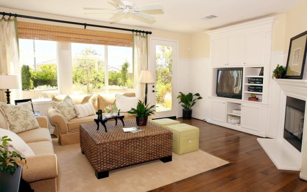 Interior,Exceptional Interior Designer Living Room Decoration With Charming Light Brown Fabric Sofas And Nice Brown Wicker Table Plus Soft Light Brown Rug On Combined Trendy Dark Brown Wood Floor Also Beautiful White Entertaimnent Center,The Best High Quality And Cheap Interior Designer Living Rooms