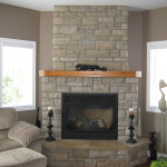 Interior,Enthralling Light Brown Wall Paint Stone Fire Places Design Inspiration With Charming Corner Cream Brick Stone Fireplace Plus Nice Brown Wood Wall Mount Shelf And Cool Black Wood Floor Candle Stand Also Comfortable Light Brown Fabric Single Seater Sofa Using Beautiful White Wood Window Frames,The Beauty Of Stone Fire Places Your Home Inspiration