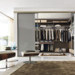 Furniture,Fabulous White Wall Paint Walk In Wardrobe Design Inspiration With Beautiful Clear Glass Sliding Door And Cool Shelves Plus Comfortable White Brown Leather Swivel Chair Also Gorgeous Glass Great Windows On Combined Nice Cream Curtians,Cool Amazing Some Walk In Wardrobe Designs