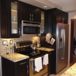 Interior,Awesome White Ceiling Small Luxury Kitchen Decoration With Charming Black Wood Kitchen Cabinet On Combined Beautiful White Marble And Picturesque Frosted Glass Door Floating Kitchen Cabinet Plus Nice  Oven Stove Built In Craft Also Wonderful Gray Subway Tile Backspash,Best Small Luxury Kitchens Inspiration