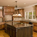 Interior,Marvelous White Ceiling Small Luxury Kitchen Decoration With Fabulous Brown Wood Kitchen Cabinet On Combined Cool Gray Granite Countertop And Wonderful Black Large Kitchen Island Plus Gorgeous Gray Granite Countertop Also Trendy Brown Wood Floor,Best Small Luxury Kitchens Inspiration
