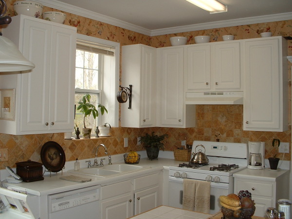 Apartments,Cool Amazing Small Space Apartment Kitchen Design Ideas With Stunning White Wood Kitchen Cabinet On Combined Beautiful White Countertop And Modern Chrome Single Handle Bathroom Faucet Also Luxurious White Wood Floating Kitchen Cabinet,Delightful Apartment Kitchen Designs And Style Modern