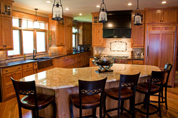 Interior,Dazzling White Ceiling Small Luxury Kitchen Design Inspiration With Charming Brown Wood Kitchen Cabinet On Combined Nice Black Marble Countertop Plus Beautiful Black Cooker Hood And Modern Curved White Granite Bar Table Also Comfortable Black Brown Wood Bar Stools,Best Small Luxury Kitchens Inspiration