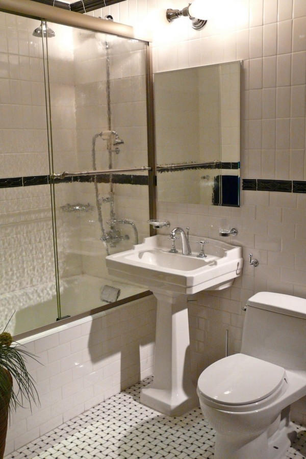 Bathroom,Amazing White Ceramic Tile Wall Small Bathroom Design Idea With Stylish White Ceramic Pedestal Plus Nice Vertical Wall Mirror And Comfortable White Ceramic Toilet Also Picturesque Bathroom Glass Sliding Door Frameless,The Best Beautiful And Small Bathroom Design Ideas