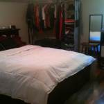 Bedroom,Stylish Small Space Storage For Small Bedroom Design Ideas With Marvelous Black Wood Bed Frame On Combined Soft White Bed Sheet And Cool Open Closet Also Nice Natural Wood Stool Plus Wonderful Vertical Wall Mirror,Modern Storage For Small Bedroom Inspiration