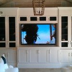 Furniture,Nice Looking Brown Wood Linen Wall Flat Screen Tv Wall Design Inspiration With Wonderful White Large Entertainment Center Plus Beautiful Black Clear Glass Doors And Vintage Pendant Lamp Also Soft White Cushions ,Stunningly Beautiful And Modern Flat Screen Tv Wall Designs