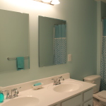 Bathroom,Delightful Light Green Wall Paint Wall Light Design Inspiration With Extraordinary Two Square Mirror And Stunning White Double Sink Plus Modern Stainless Steel Bathroom Faucets Also Cozy White Ceramic Toilet,Classic Wall Lights Inside Bathroom