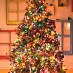 Furniture,Dazzling White Mixed Yellow Wall Paint Xmas Tree Design Ideas With Style Cristmas Tree And Beautiful Colorfull Lightning Also Gorgeous Blazing Trinkets Plus Adorable Colorfull Ball Ornaments,Awesome Xmas Trees Latest For Christmas