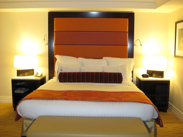 Bedroom,Astounding Yellow Background Really Cool Bedroom Design Ideas With Comfortable Whtie Fabric Bed Sheet And Gorgeous Brown Black High Headborad Plus Beautiful Black Wood Nightstand Tables Also Soft Beige Leather Bench,Really Cool Bedrooms Designed With A High Comfort Level