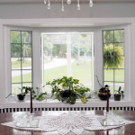 Furniture,Fascinating Light Blue Wall Paint Plus Beautiful Black White Striped Bay Window Decorating With Beautiful White Wood Window Frame And Cool Potted Plants Also Trendy Brown Wood Dining Table,Contemporary Bay Window Decorating