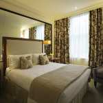 Bedroom,Luxurious Glass Mirror Themed Very Small Bedroom Design Ideas With Comfortable White Mattress On Combined Soft White Cotton Pillow And Comfortable Gray Sofa Chair Also Wonderful Beige Curatins Plus Floral Ornament ,Very Small Bedroom Design And Small Space