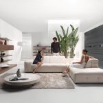 Furniture,The Best High Quality Sofa For Small Living Room Design Ideas With Modern White Leather Sectional Sofa And Beautiful White Round Tuscan Side Table On Combined Soft Gray Area Rug Also Cool Stylish Open Shelves ,The Most Convenient Sofas For Small Living Rooms