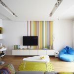 Apartments,Fabulous White Wall Paint Apartment Ideas With Nice White Entertaiment Center And Cool Bright Brown Wood Flat Desk Plus Comfortable Office Chair On Combined Trendy Brown Wood Floor Also Unique White Table,Comfort Studio For Contemporary Apartment Ideas