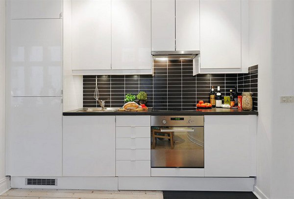 Apartments,Contemporary White Wall Paint Apartment Kitchen Design Ideas With Charming White Wood Kitchen Cabinet On Combined Nice Black Countertop And Beautiful Black Subway Tile Backspash Also Trendy Bright Tile Floor,Delightful Apartment Kitchen Designs And Style Modern