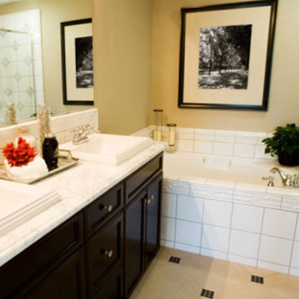 Apartments,Pretty Bathroom Design For Apartement With Charming White Ceramic Countertop On Combined Double Sink Plus Black Vanity Cabinet And Style Large Glass Mirror Also Comfortable White Ceramic Bathtub,Gorgeous Small Space Bathroom Designs For Apartments