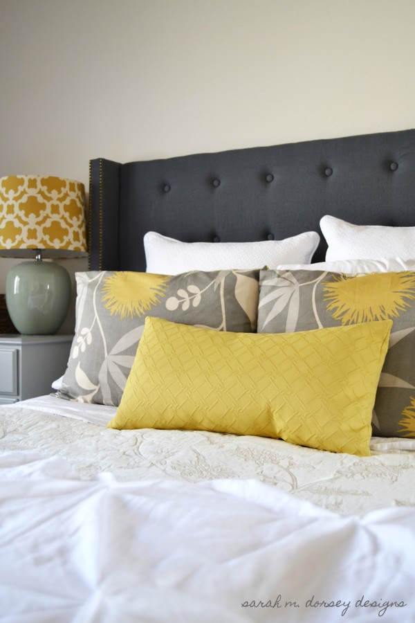 Bedroom,Amazing Headborad Design Ideas In Black Color White Soft Some Pillows And Stylish White Bed Cover Also Wonderful White Wood Nightstand Table On Combined Gorgeous Yellow White Drum Table Lamp Using Exquisite White Wall Paint,Comfortable Bed With Headboard Designs