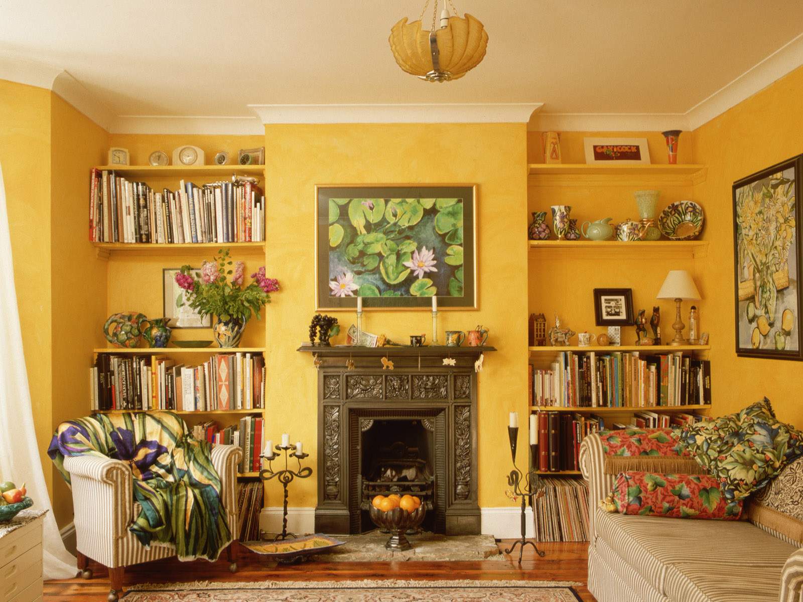 Furniture,Best Interior Design Ideas With Impressive Brown Sofa And Cool Yellow Wood Bookcase On The Yellow Wall Also Gorgeous Black Fireplace,Best Interior Design Ideas To Your Home