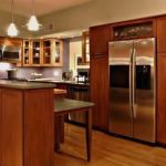 Furniture,Beautiful Contemporary Kitchen Design Inspiration With Glamorous Wood Kitchen Cabinet And Cool Clear Glass Door Floating Kitchen Cabinet On Combined Brown Color Also Wonderful Two Hanging Lamp For Rustic Concept,Beautiful Contemporary Kitchens