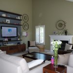 Furniture,Impressive Green Pale Flat Screen Tv Wall Design Ideas With Charming Brown Wood Entertainment Center On Combined Beautiful White Drum Desk Lamps Plus Comfortable White Sofas Also Nice Fireplace ,Stunningly Beautiful And Modern Flat Screen Tv Wall Designs