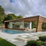 Architecture,Trendy Large Modern House Design With Awesome Green Trees Around And Beautiful Brown Stone Wall Also Comfortable White Wood Pool Chaise Lounge Plus Adorable Pool,Flawless Large Modern Houses Inspiration