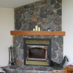 Interior,Enchanting White Wall Paint Stone Fire Places Decoration With Amazing Gray Stone Fireplace And Nice Brown Wood Wall Mount Shelf Also Cool Three White Candle,The Beauty Of Stone Fire Places Your Home Inspiration