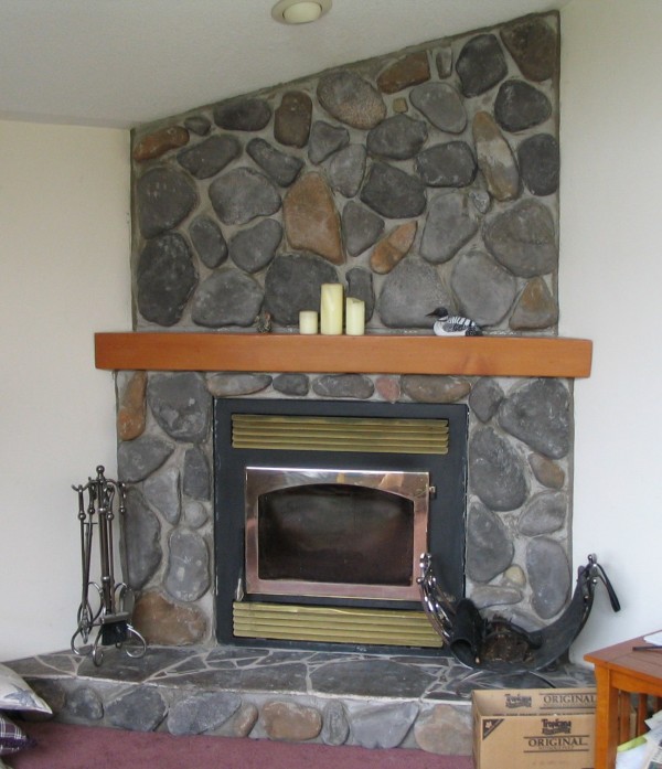 Interior,Enchanting White Wall Paint Stone Fire Places Decoration With Amazing Gray Stone Fireplace And Nice Brown Wood Wall Mount Shelf Also Cool Three White Candle,The Beauty Of Stone Fire Places Your Home Inspiration