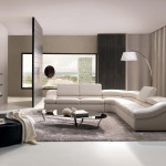 Interior,Minimalist Interior Designer Living Room Decoration With Modern White Leather Sectional Sofa And Cool Black Glass Oval Shaped Table On Combined Soft Gray Rug Plus Picturesque White Drum Arc Floor Lamp Also Exquisite Black Ottoman,The Best High Quality And Cheap Interior Designer Living Rooms